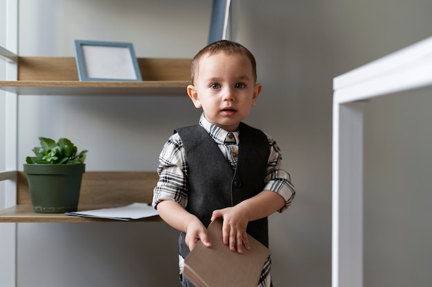 Baby dressed up as business person