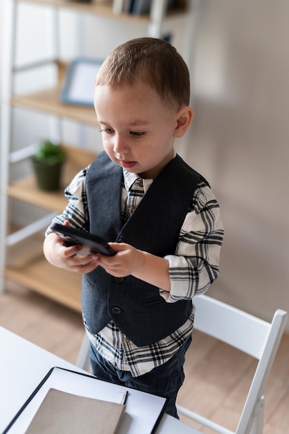 Free photo baby dressed up as business person