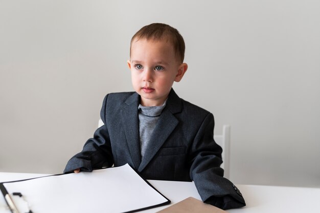 Baby dressed up as business person