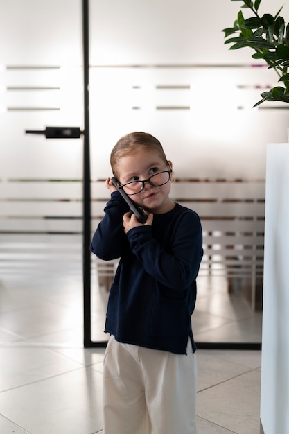 Baby dressed up as business person