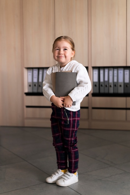 Baby dressed up as business person