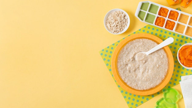 Baby food frame on yellow background