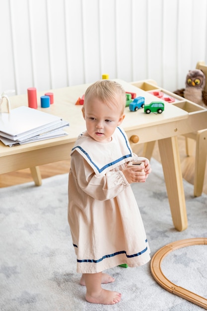 Free photo baby girl in a cute sailor dress