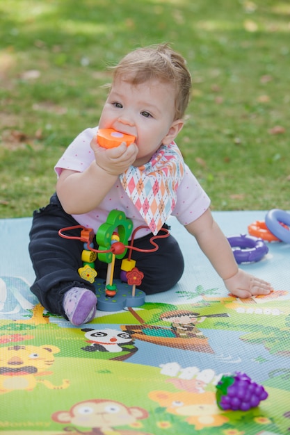 Free photo baby, less than a year old   playing with  toy