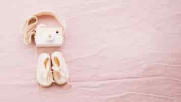 Free photo baby-shoes and toy camera