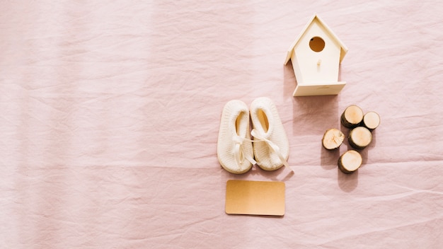 Free photo baby-shoes and wooden decorations