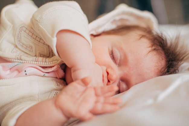 Free photo baby sleeping on bed peacefully