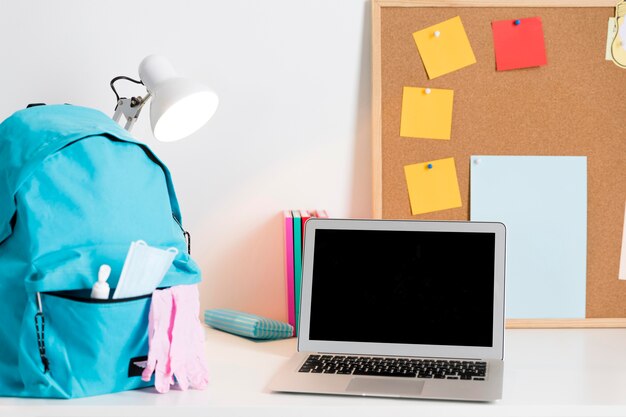 Back to school arrangement in new normal times with laptop