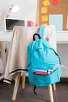 Free photo back to school assortment with blue backpack