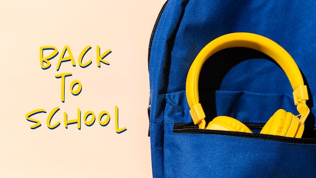 Free Photo back to school concept with backpack and headphones