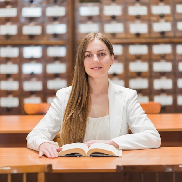 Back to school concept with woman studying in library