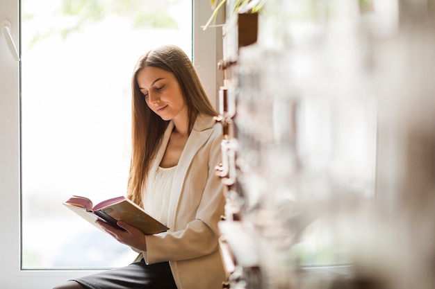 Back to school concept with woman studying in library