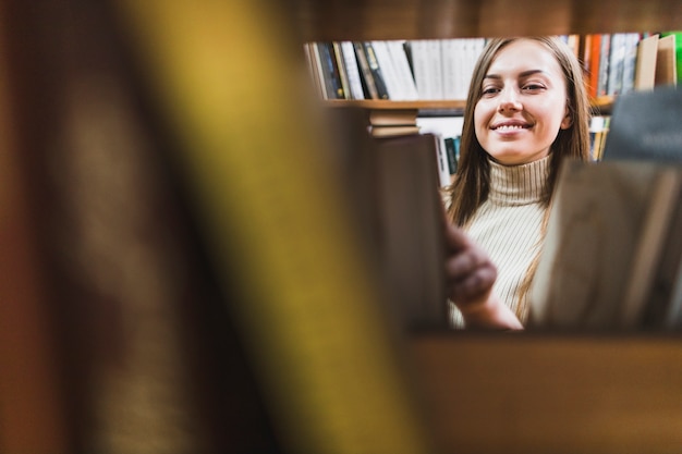 Free Photo back to school concept with woman studying in library