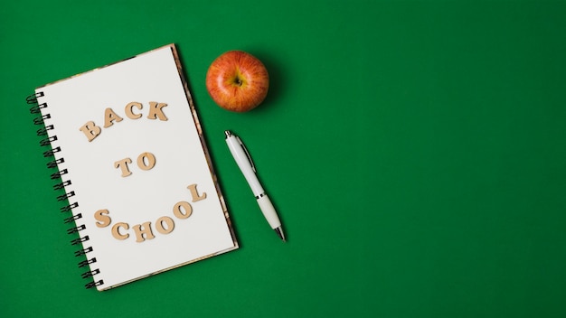 Free Photo back to school on green background