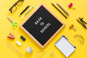 Free photo back to school lettering on board with office accessories