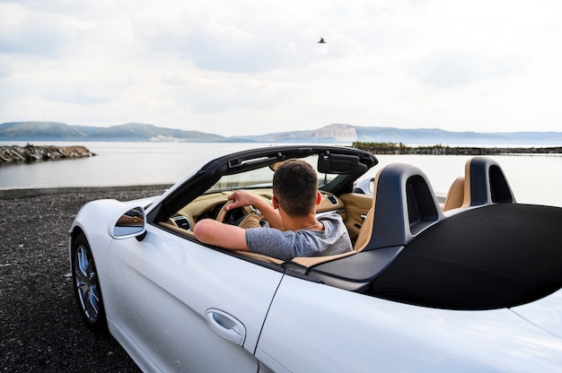 Back shot of man driving