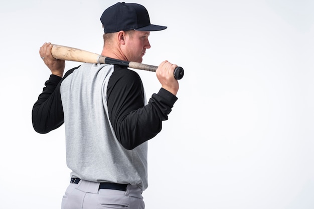 Back view of baseball player with bat