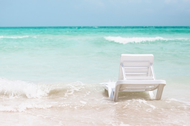 Free Photo back view beach chair at the seashore