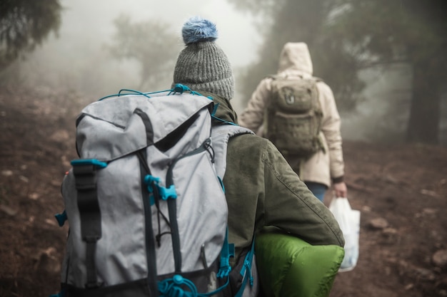 Back view climbers with backpacks