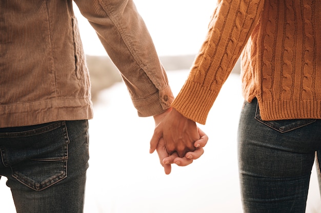 Back view couple holding hands