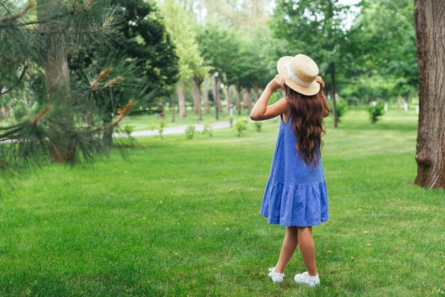 Back view girl posing outdoors