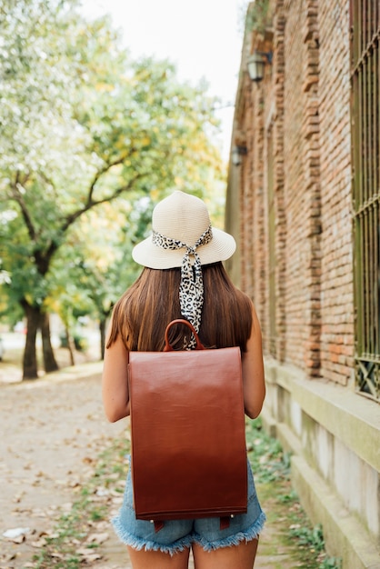 Free photo back view girl with vintage backpack