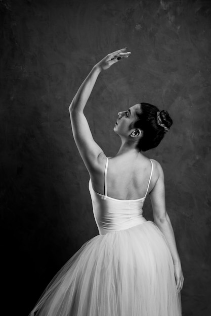 Free Photo back view greyscale ballet posture