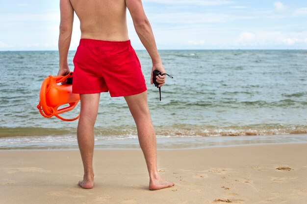 Back view lifeguard on beach