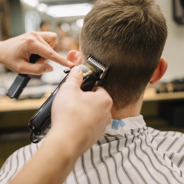 Back view of man getting a haircut