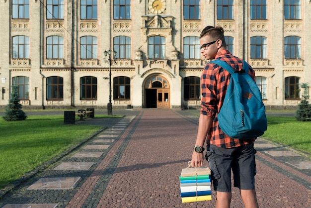 Free photo back view medium shot of highschool student looking sideways