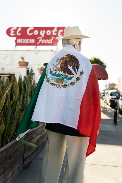 Free photo back view old man with mexican flag