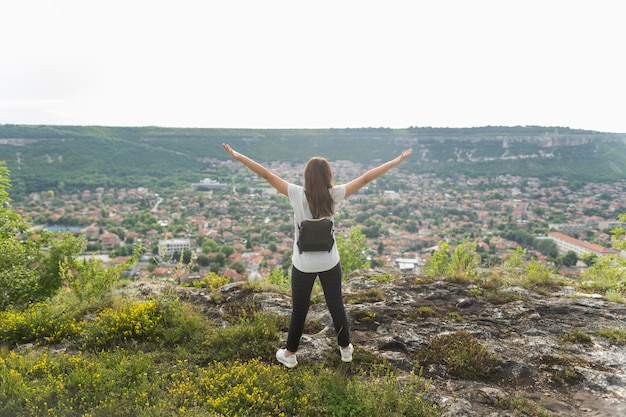 Free photo back view of woman enjoying nature time