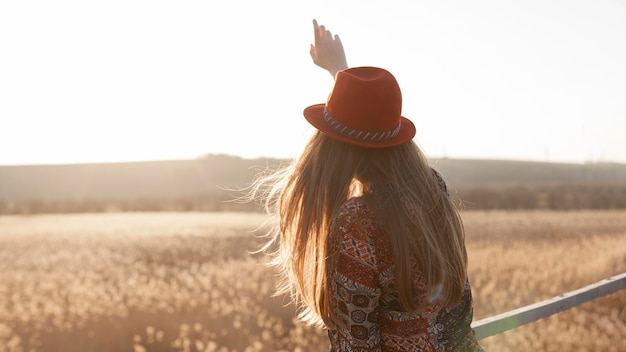 Back view of woman posing in nature