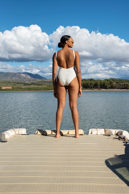 Back view woman wearing bathing suit