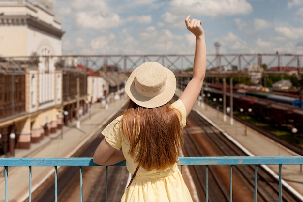 Free Photo back view woman wearing hat