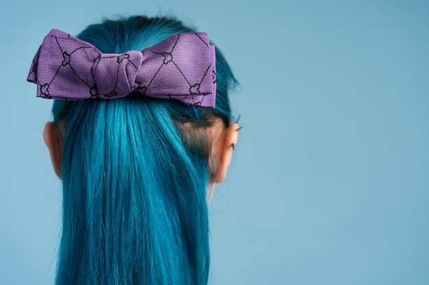 Back view woman wearing purple ribbon