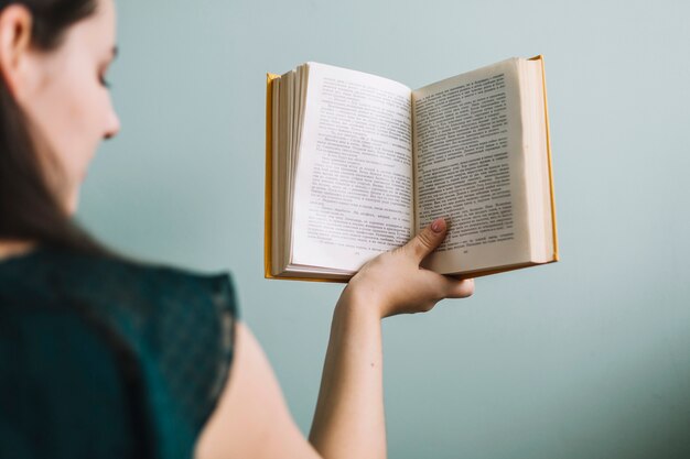 Back view woman with book