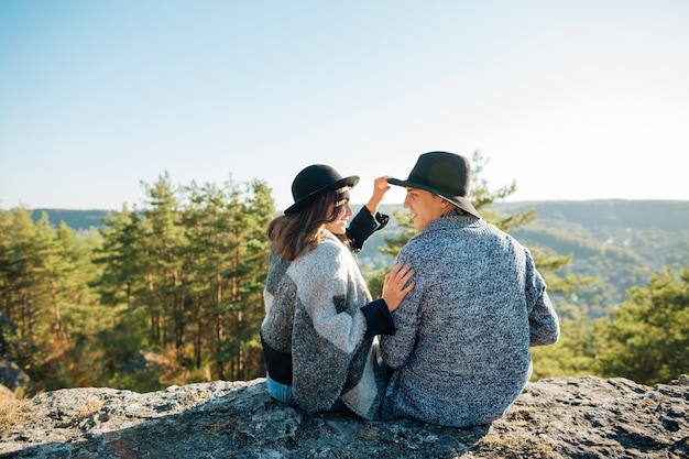 Free Photo back view young couple in the nature