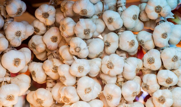 Background of garlic. close up of garlic on market stand