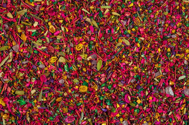 Background of multicolored dried flower petals blooms and herbs top view