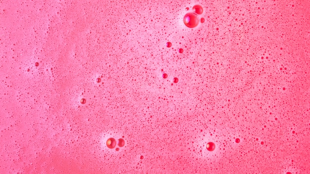 Free photo background of pink dissolve bath bomb in water