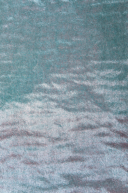 Background of seamless turquoise sequin