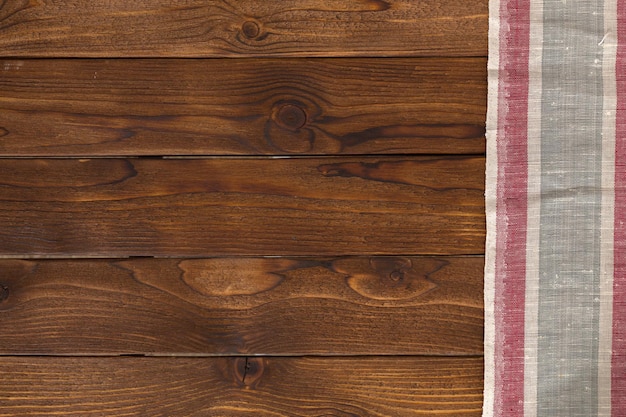 Background with empty wooden table with tablecloth