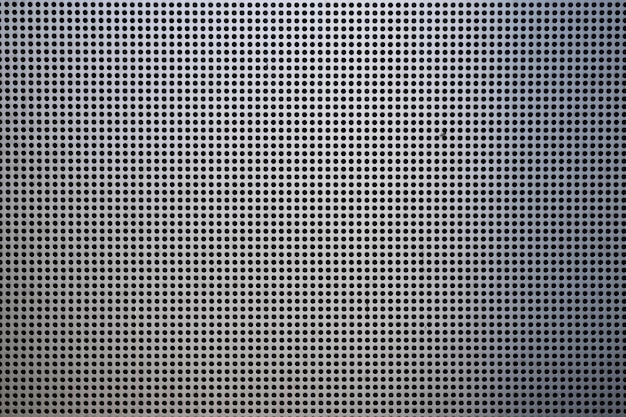 Free photo background with metallic mesh and round holes