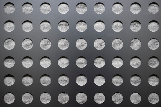 Background with metallic mesh and round holes