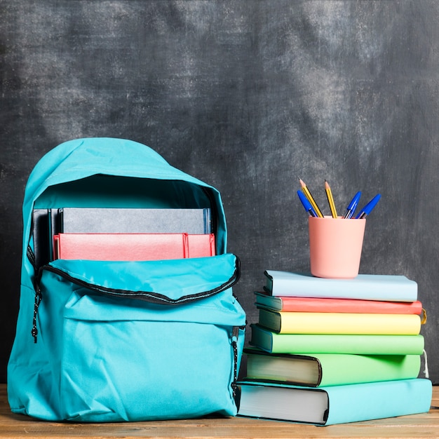 Backpack with books and pens