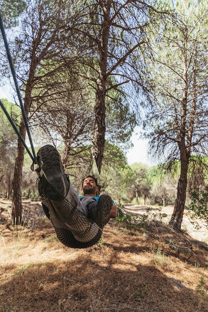 Free photo backpacker chilling in hammock