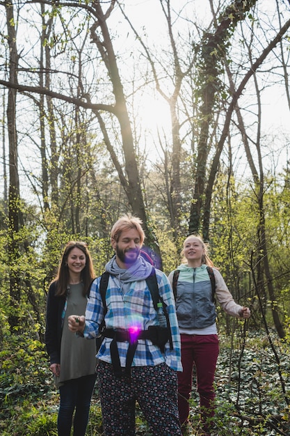 Free photo backpacker friends in forest