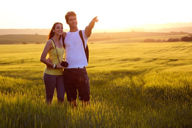 backpacks hill male walking couple