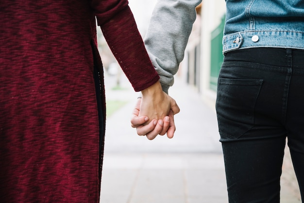 Free Photo backview of couple holding hands